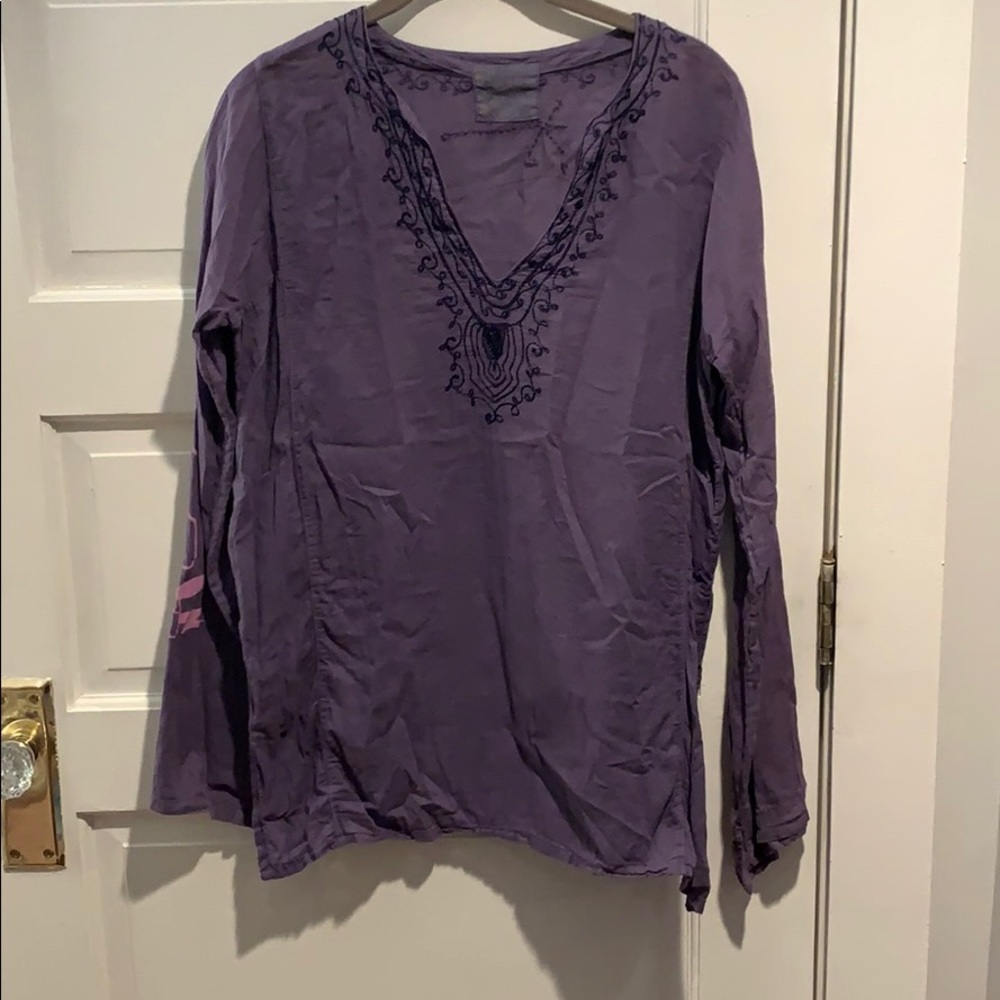 Purple top with various designs